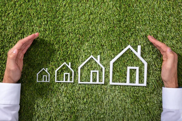 Person Hand Protecting Increasing Outline House Green Grass — Stock Photo, Image