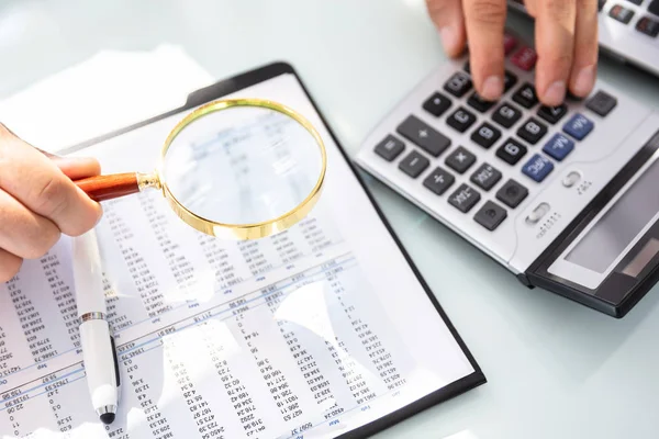 Businessman Hand Using Calculator While Analyzing Financial Report Magnifying Glass — Stock Photo, Image