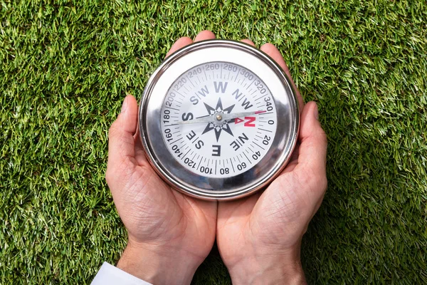Elevated View Man Holding Compass Green Grass — Stock Photo, Image