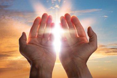 Close-up Of A Praying Hands With Sunlight clipart