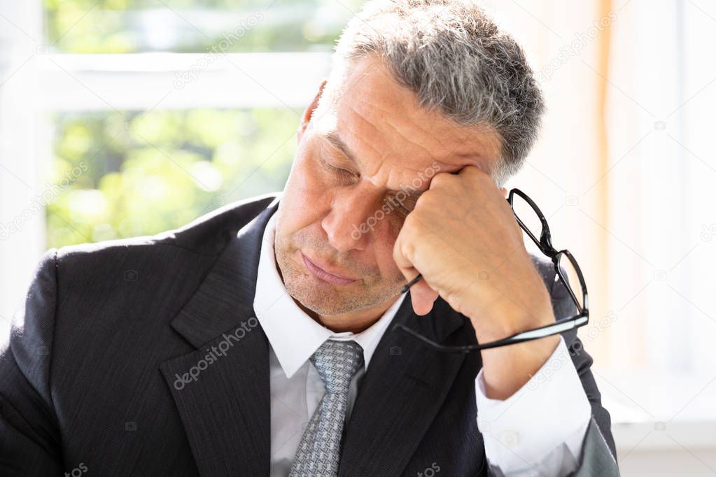 Photo Of Tired Mature Businessman Sleeping In Office