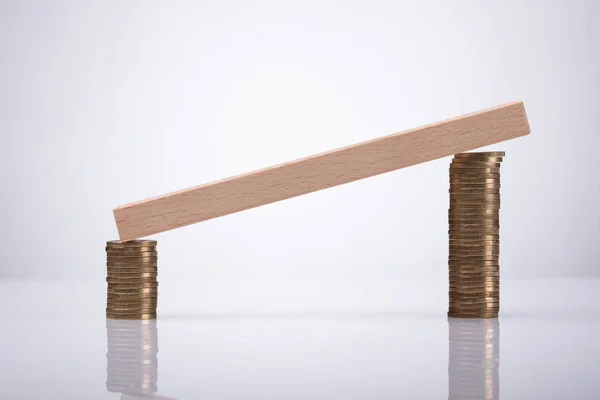 Wooden Block Stacked Coins Reflective Desk — Stock Photo, Image