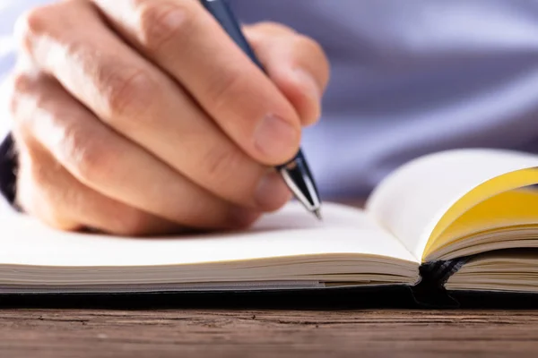 Person Hand Writing Notebook Using Pen — Stock Photo, Image