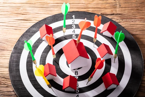 Multi Colored Dart Arrows Hitting House Model Dartboard Wooden Table — Stock Photo, Image