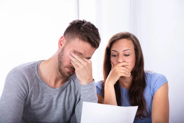 Portrait Sad Young Couple Looking Invoice — Stock Photo, Image