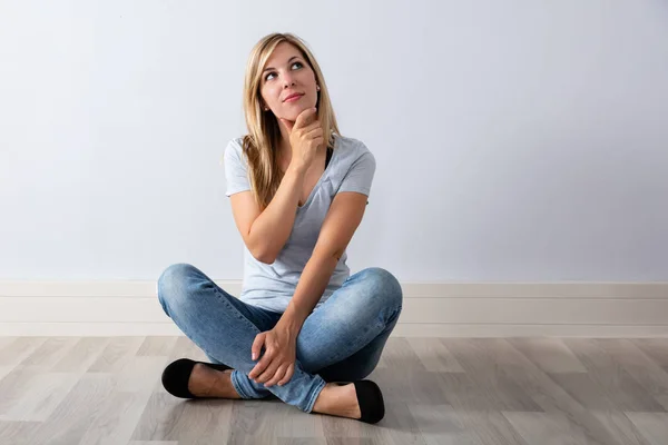 Portrait Contemplated Young Woman Sitting Hardwood Floor — Stock Photo, Image
