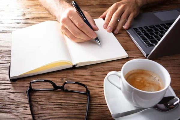 Close Person Writing Notebook Wooden Desk Stock Picture