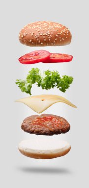 Close-up Of Hamburger Ingredients On Black Background clipart