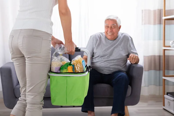 Father Looking His Daughter Holding Groceries Basket — Stock Photo, Image