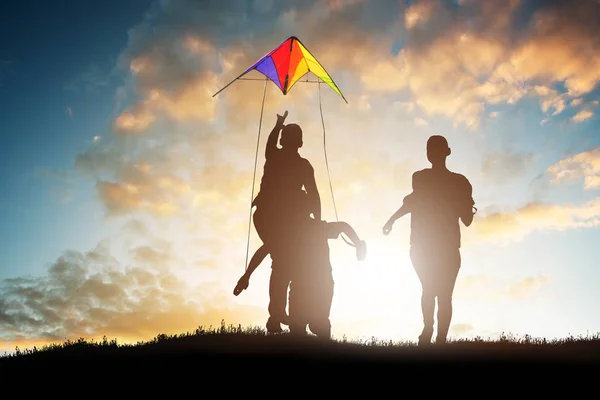 Silhouette Family Playing Colorful Kite Sunset — Stock Photo, Image