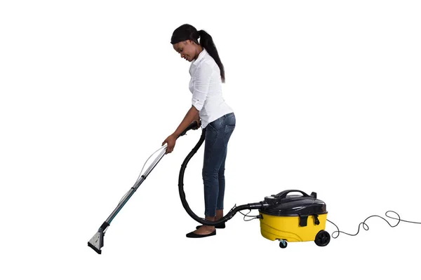 Young African Woman Using Vacuum Cleaner White Background — Stock Photo, Image