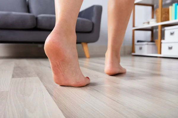 Close Woman Foot Walking Heated Hardwood Floor — Stock Photo, Image