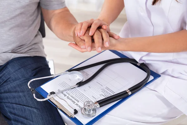 Doctor Holding Senior Patient Hand Clipboard Stethoscope — Stock Photo, Image