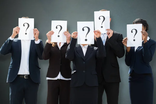 Group Businesspeople Hiding Faces Question Mark Sign Grey Background — Stock Photo, Image