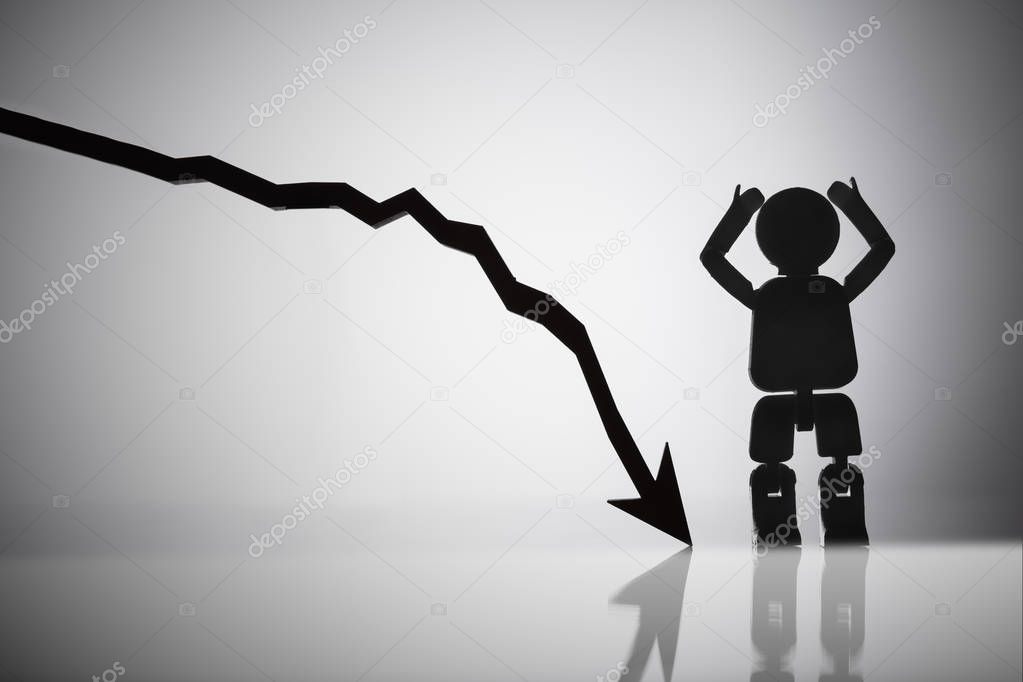 Human Figure Standing Besides Arrow Moving In Downward Direction On Reflective Background