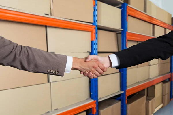 Partners Shaking Hands Front Cargo Shelves — Stok Foto