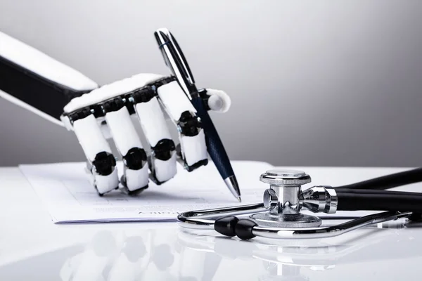 Robotic Hand Filling Form Stethoscope Desk — Stock Photo, Image