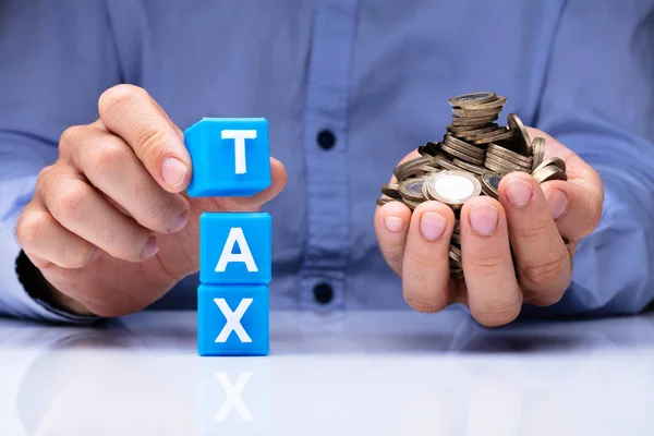 Close Person Hand Holding Blue Tax Cubic Blocks Golden Coins — Stock Photo, Image