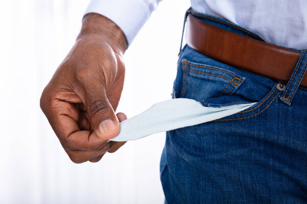 Midsection View Of A Man's Hand Showing Empty Pocket