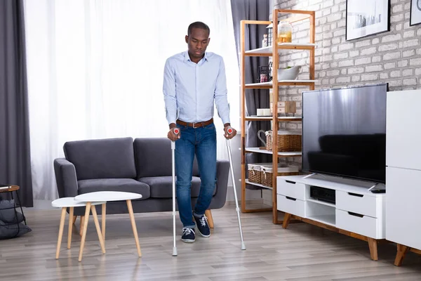 Disabled Man Using Crutches Walking Floor — Stock Photo, Image