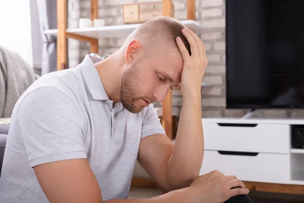 Side View Upset Young Man Sitting Sofa — Stock Photo, Image