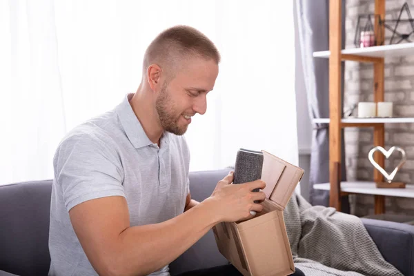 Smiling Young Man Removing Wireless Speaker Parcel Home — Stock Photo, Image