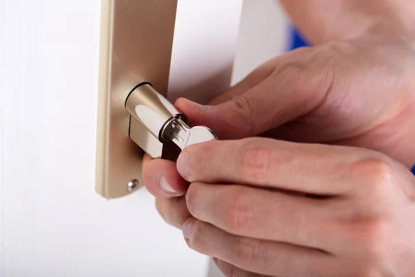 Close Carpenter Hand Inserting Key Keyhole — Stock Photo, Image