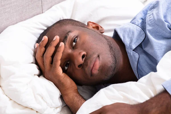 Young African Man Suffering Fever Lying Bed — Stock Photo, Image