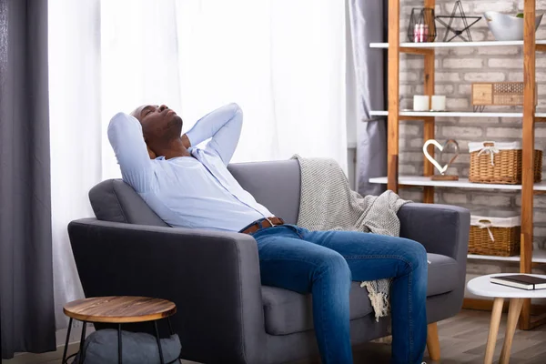 Young African Man Relaxing Sofa Home — Stock Photo, Image