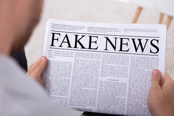 Close Man Hand Holding Newspaper Fake News — Stock Photo, Image