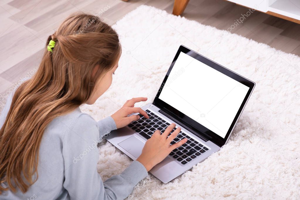 Girl Using Laptop With Blank White Screen