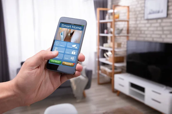 Mans Hand Holding Cellphone Smart Home Application Home — 스톡 사진