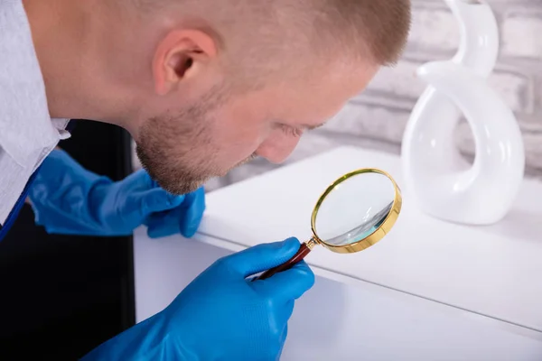 Close Young Male Janitor Examining Cabinet Magnifying Glass — Stock Photo, Image