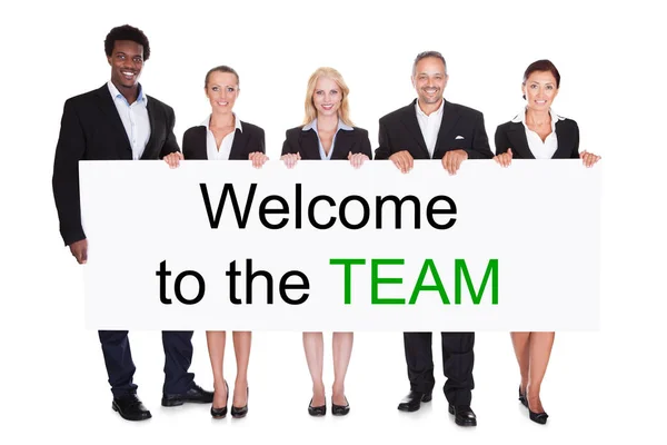 Group Smiling Businesspeople Holding Welcome Team Placard White Background — Stock Photo, Image