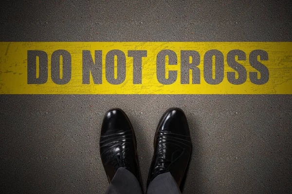 Person Feet Standing Yellow Line Cross Text Asphalt — Stock Photo, Image