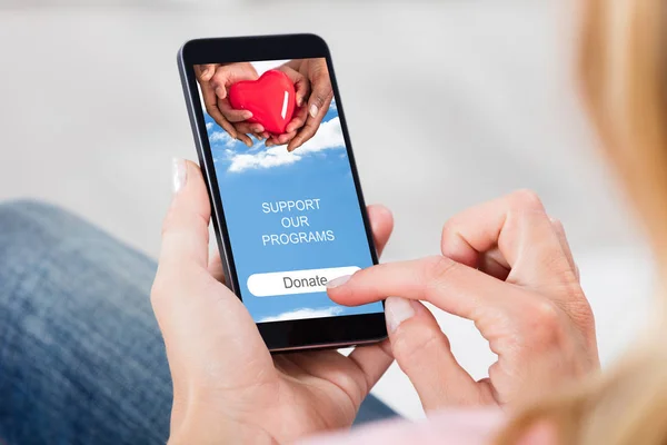 Close Person Hand Donating Money Cellphone — Stock Photo, Image