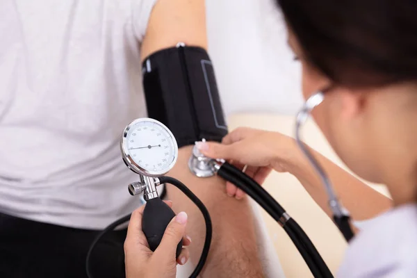Close Doctor Measuring Blood Pressure Male Patient Royalty Free Stock Images