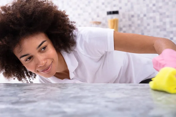 Happy African Young Woman Cleaning Dirty Kitchen Counter Spray Detergent — Stock Photo, Image