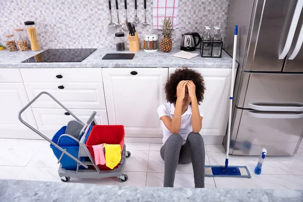 Exhausted African Young Woman Sitting Floor Kitchen — Stock Photo, Image