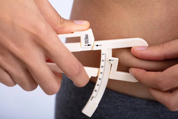 Close Slim Woman Using Fat Caliper Measure Body Fat Waist — Stock Photo, Image