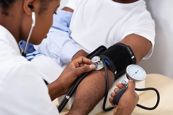 Close Doctor Hand Measuring Blood Pressure Male Patient — Stock Photo, Image