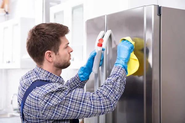 Side View Young Man Cleaning Refrigerator Napkin Bottle — Stock Photo, Image