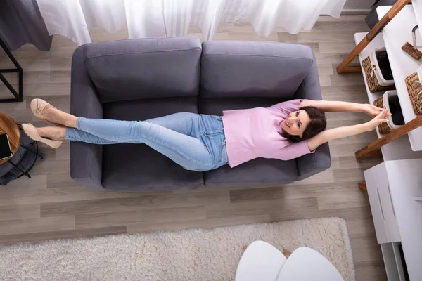 Smiling Young Woman Lying Sofa Home — Stock Photo, Image