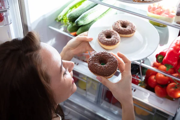 Young Happy Woman Taking Donut Plate Refrigerator — Stock Photo, Image