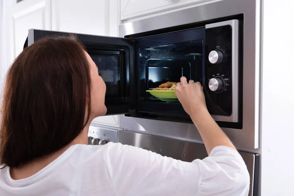 Close Young Woman Heating Fried Food Microwave Oven — Stock Photo, Image