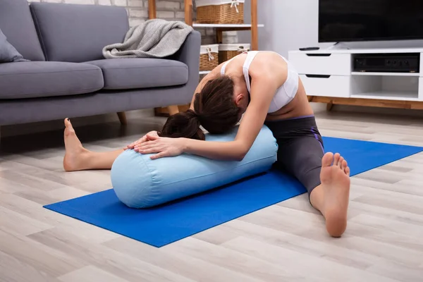 Young Woman Practicing Yoga Bolster Home — Stock Photo, Image
