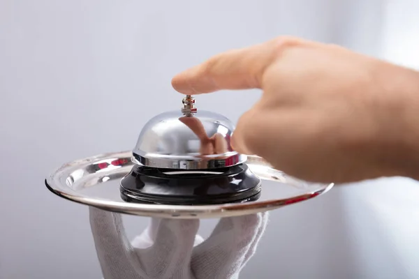 Close Person Hand Ringing Service Bell Plate Held Waiter — Stock Photo, Image