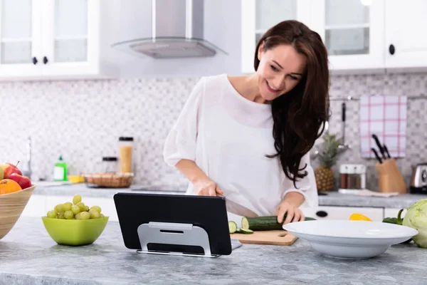 Happy Young Woman Using Digital Tablet While Cooking Food Kitchen — Stock Photo, Image