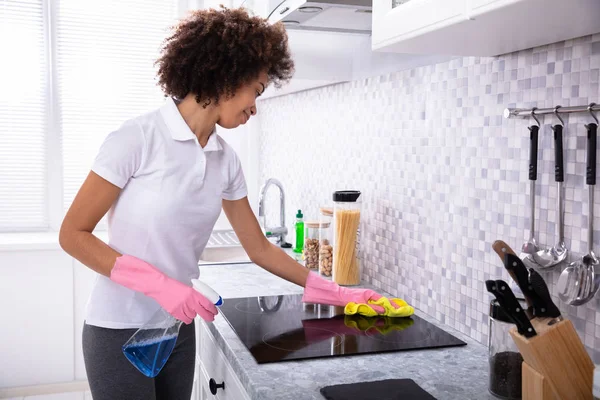 Close Young Woman Cleaning Induction Stove Sponge Spray Detergent Kitchen — Stock Photo, Image