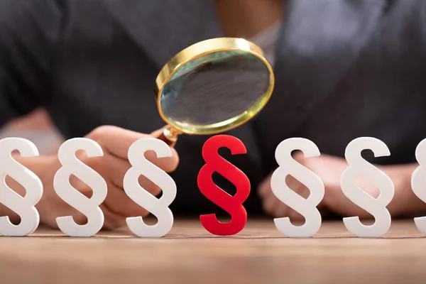 Close Businesswoman Hand Looking Red Paragraph Sign Magnifying Glass Wooden — Stock Photo, Image